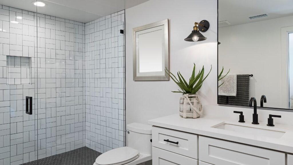 Luxury bathroom decorations combining teak wood paneling, white marble tile, and a built-in soaking tub