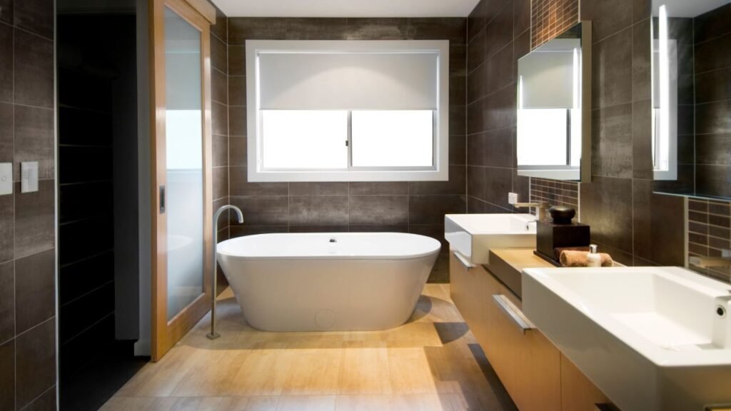 Contemporary bathroom decorations showcasing geometric white subway tile, black hardware, and hexagon floor tile
