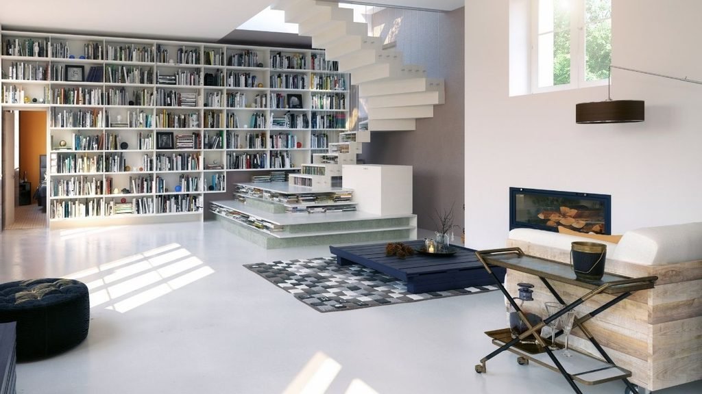 Modern loft living room with a floor-to-ceiling white bookshelf, floating staircase, and built-in seating with cushions