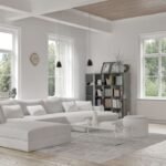 Elegant gray living room with wainscoting wall paneling, framed botanical prints, twin round coffee tables, and herringbone wood flooring