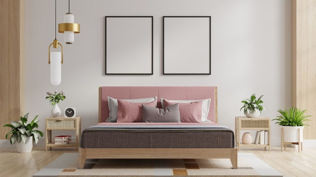 Pair of light wood rattan nightstands beside a pink upholstered bed in a modern bedroom with plants and pendant lights