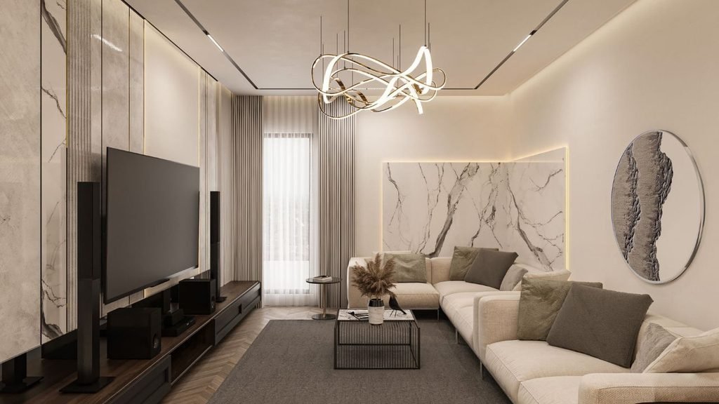 Modern living room with a marble accent wall, sculptural gold chandelier, and a round textured wall disc above a beige sectional