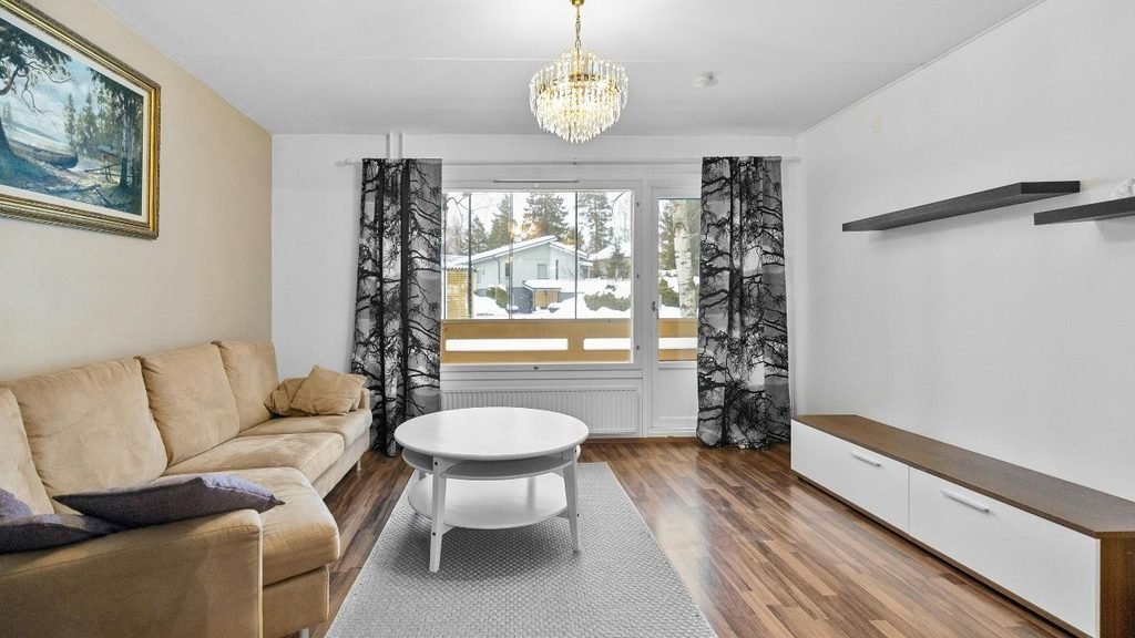 Living room with smooth painted walls and no paneling, a useful comparison for the beadboard vs wainscoting difference
