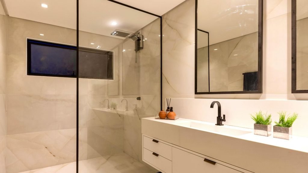 Bathroom remodel ideas for a walk-in shower: black-framed glass, onyx-look tile and a white floating vanity
Keyword usage