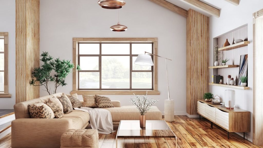 Rustic living room with exposed wood beams, copper pendant lights and a beige sectional with chevron pillows.
